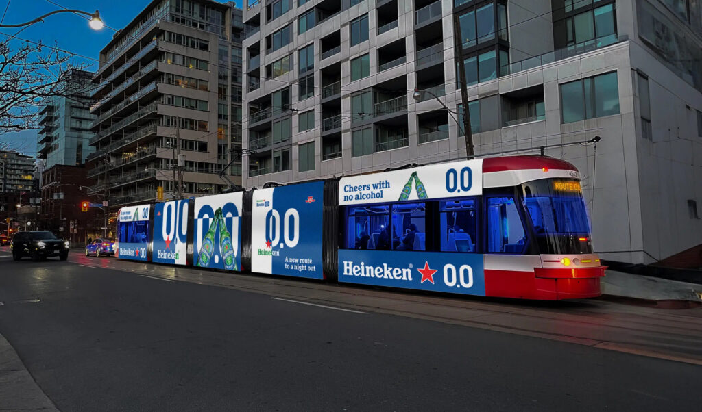 Exterior view of a bus in Heineken colors.